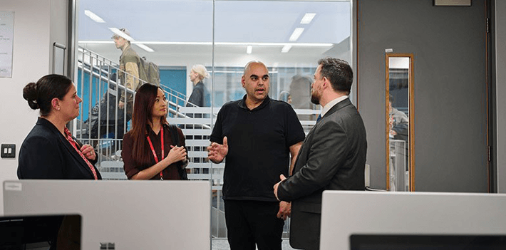 Jisc and Aston Manor staff hold a group discussion.