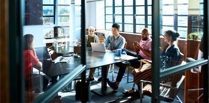 Leaders collaborating in a meeting room.