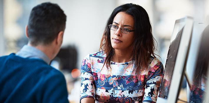 Two colleagues in a meeting.
