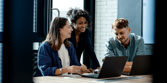 Team of business development is on a data discussion to improve solutions, products, or services during a meeting in a business office.