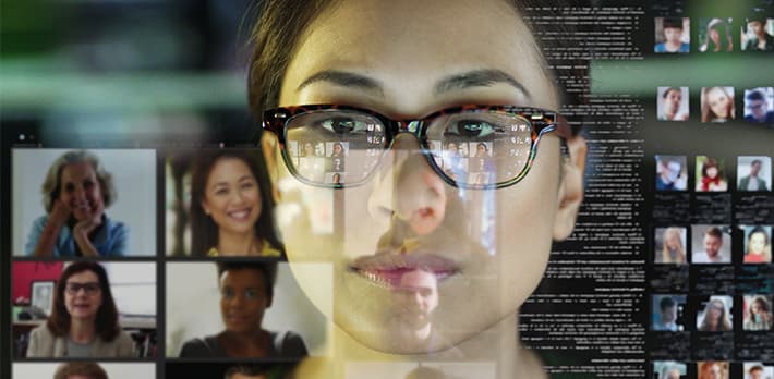 A woman looks at data on a screen.
