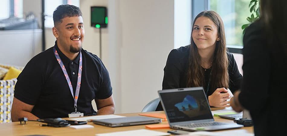 early-careers-group-smiling-presentation-resized