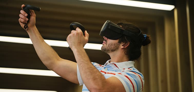 A man tries out a virtual reality headset.