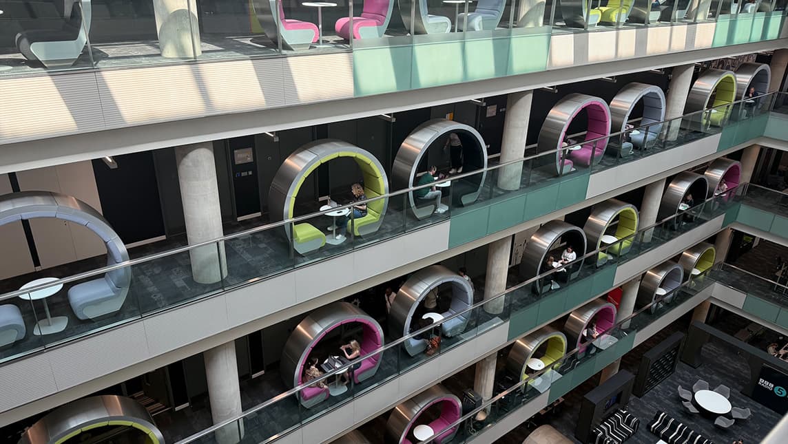 View of headphone-shaped seats on several building levels.