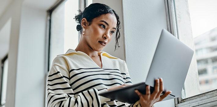 A student read an e-textbook on their laptop.