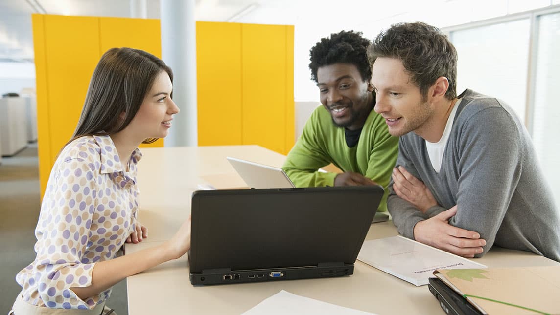 Three university staff in a meeting.