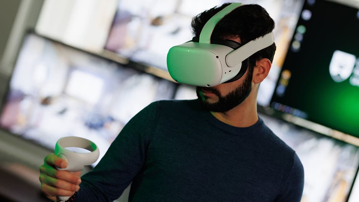 A researcher uses a VR headset at the University of Dundee.