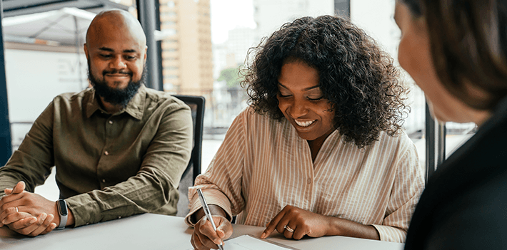 Leaders in a meeting work together.