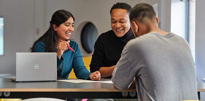 A group of students sitting around a table.